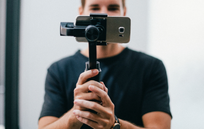 Man holding a gimbal with a phone